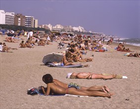 Crowded beach with sunbathers in Calella, Costa Brava, Barselona, Catalonia, Spain, Southern Europe