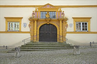 Portal with columns and decorations from the Renaissance castle built in 1580, staircase, yellow,