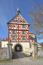 Historic gate tower built in 1545 and landmark, gatehouse, half-timbered house, Burgbernheim,
