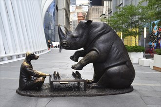 Bronze artwork for endangered animals, rhino and dog playing chess, exhibition A Wild Life for