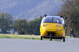 Man Driving an Electric Car in Switzerland