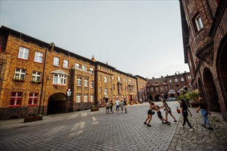 Nikiszowiec, Poland, 14 April, 2020: Group of kids fighting on the courtyard in Katowice mining