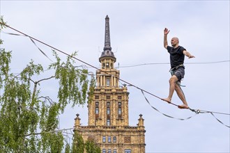 Riga. Alternative cultural centre near the Latvian Academy of Science. Tightrope walker on the