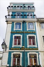 Old building, facade with typical azulejos, tiles in the old town, city, architecture, green,