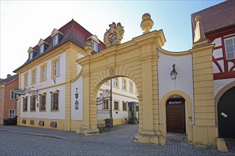 Yellow inn Zehntkeller with archway, Iphofen, Lower Franconia, Franconia, Bavaria, Germany, Europe