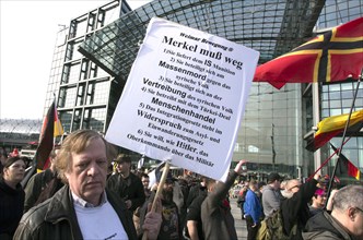 A participant in the Merkel muss weg demo. Demonstration by right-wing populist and far-right