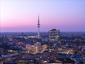 Aerial view at blue hour Heinrich Hertz television tower with exhibition centre, Hamburg, Germany,