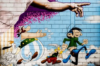Painted house wall with comic figures, Asterix and Obelix, graffiti, Porte de Clignancourt, Paris,