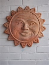 Terracotta sun for garden and house decoration, North Rhine-Westphalia, Germany, Europe