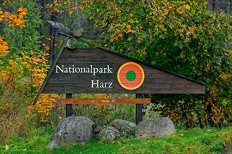 Wooden welcome sign in the Harz National Park, German nature reserve in Lower Saxony and