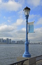 Street light marking the potential future flood level caused by global warming, Hudson River, Lower