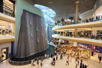 Artificial waterfall in the Dubai Mall shopping centre. The largest mall in the world offers