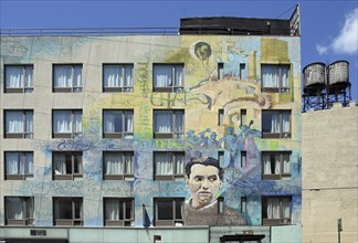 Mural, graffiti man musician and wolf, on residential building, SoHo neighbourhood, Manhattan, New
