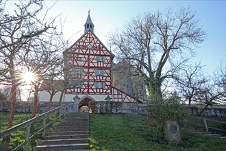Historic gate tower built in 1545 in backlight and landmark, gatehouse, half-timbered house,