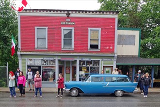 People and classic cars in front of a historic facade, Canada Day, Stewart