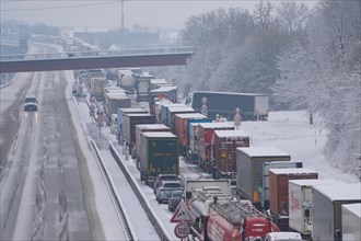 Traffic jam on the snow-covered A61 motorway. Winningen, Rhineland-Palatinate, Germany, Europe