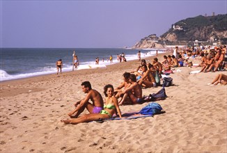 Sunbathers on the beach in Calella, Costa Brava, Barselona, Catalonia, Spain, Southern Europe.