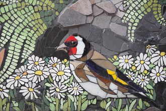 Wall mosaic with goldfinch by Isidora Paz Lopez 2019, one, colourful, yellow, red, bird figure,
