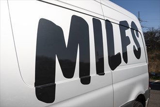 On Milf's modified lettering on a van of the car sharing provider Miles, Duesseldorf, Germany,
