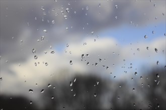 Raindrops on a window pane, North Rhine-Westphalia, Germany, Europe