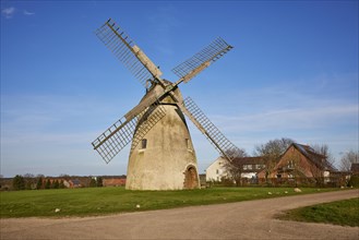 Windmill Auf der Hoechte under a cloudless blue sky is part of the Westphalian Mill Road in Hille,