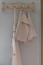 Decorative board with hooks for tea towels and aprons in a 19th century kitchen, Open-Air Museum of