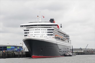 A large cruise ship QUEEN MARY 2, at a mooring in cloudy weather, Hamburg, Hanseatic City of
