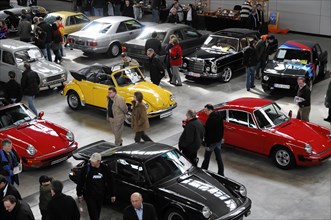 RETRO CLASSICS 2010, Stuttgart Messe, people inspect various classic cars and sports cars at a