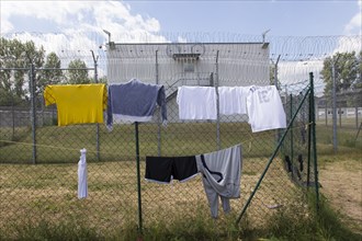 Laundry hanging to dry on a washing line in the central contact point for asylum seekers in the