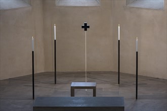 4 candles and a glass cross at the former altar site, St Clare's Church, Koenigstrasse 66,