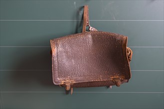 Leather school bag hanging in a classroom from the 19th century, Open-Air Museum of Folklore