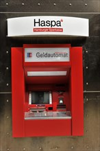 A red Haspa ATM embedded in a wall with a secure appearance, Hamburg, Hanseatic City of Hamburg,