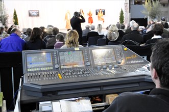 RETRO CLASSICS 2010, Stuttgart Messe, sound engineer working on a digital mixing console during an