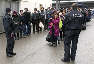 Refugees arriving at Rosenheim station, being taken to registration by federal police officers,