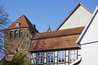 Roof of a half-timbered house, gable and tower of St Martini's Church in Minden, Muehlenkreis