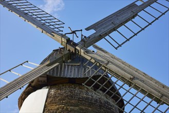 Wings of the Eickhorst windmill under a blue sky in Hille, Muehlenkreis Minden-Luebbecke, North