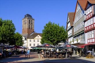 Pedestrian zone with restaurant and street cafe, Linggplatz, bell tower of the Gothic town church,