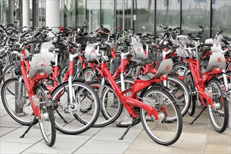 Row of red rental bicycles parked at an outdoor bicycle stand, Hamburg, Hanseatic City of Hamburg,