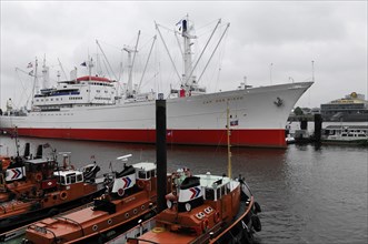 The museum ship 'Cap San Diego' parked in the cloudy harbour under an overcast sky, Hamburg,