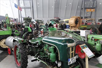 RETRO CLASSICS 2010, Stuttgart Messe, Collection of classic green tractors in an exhibition hall,