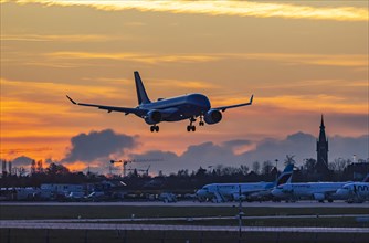 Evening sky with sunset at the airport, aeroplane landing, Stuttgart, Baden-Wuerttemberg, Germany,