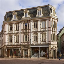 Historic residential and commercial building with retail shops in the historic centre of Colmar,