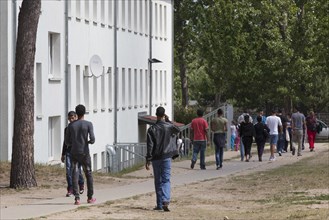 Refugees at the central contact point for asylum seekers in the state of Brandenburg in