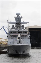 Grey military ship in the harbour, equipped with gun turrets, Hamburg, Hanseatic City of Hamburg,