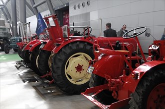 RETRO CLASSICS 2010, Stuttgart Messe, series of old red tractors presented as an exhibited