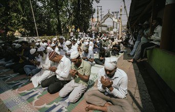 Muslim devotees offer the first Friday prayers of the holy month of Ramadan at a Mosque, on March