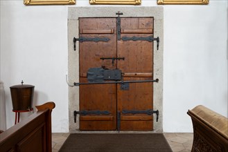 An old church door, locked with several latches, from the early 18th century, Church St. Michael,