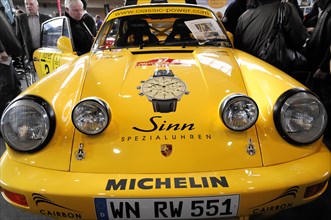 RETRO CLASSICS 2010, Stuttgart Messe, Front view of a yellow Porsche with trophy on the bonnet,