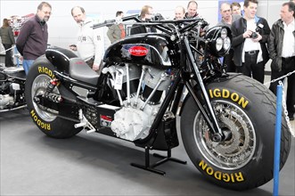 RETRO CLASSICS 2010, Stuttgart Messe, A black motorbike with RIGDON tyres is viewed by people at a