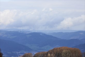 Distant view in the Black Forest over haze-covered, wooded hills as seen from Hofstetten,